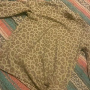 This old navy sweater is cream and tan the size is ten to a twelve